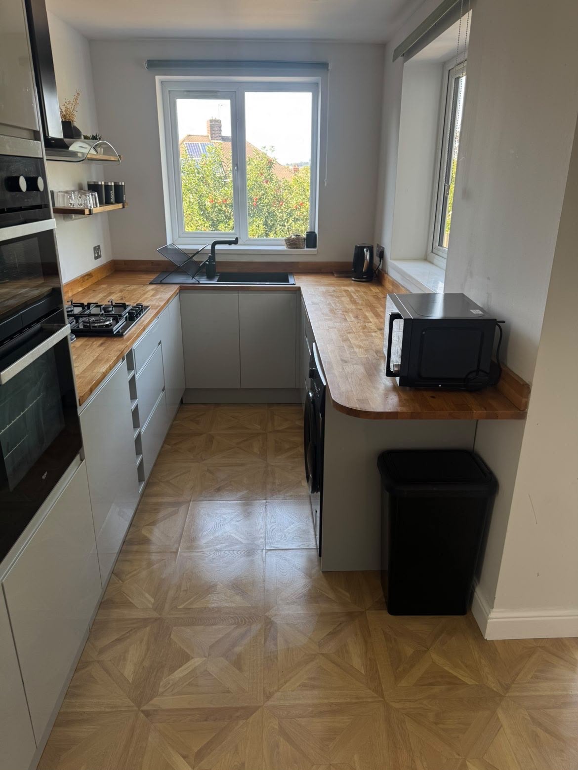 Fitted kitchen cleaned and reset ready for the next guests