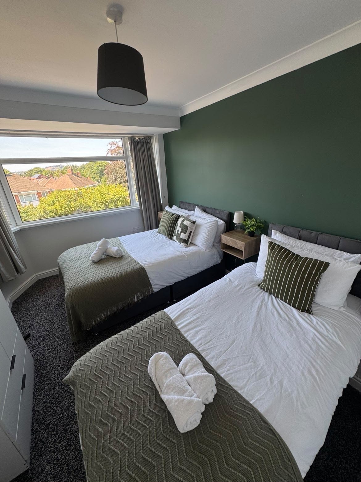 Twin bedroom cleaned and beds made with fresh linen for guest arrival